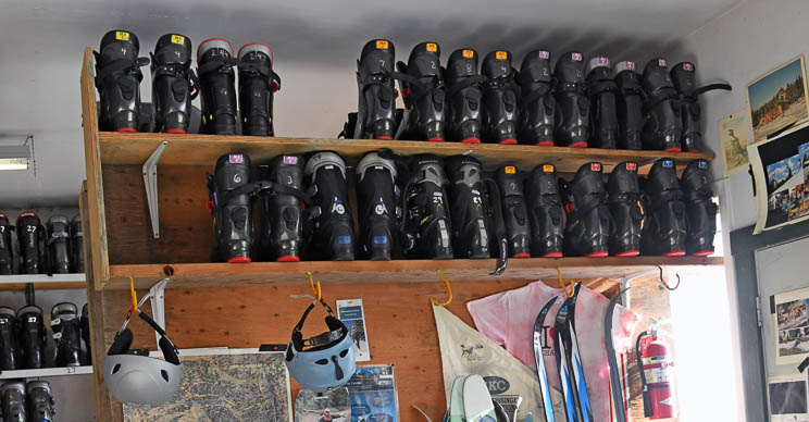 a wall of ski boots